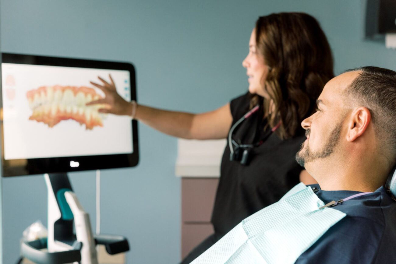 Dr. Morgan Chambers with dental patient at Complete Dentistry For all Ages